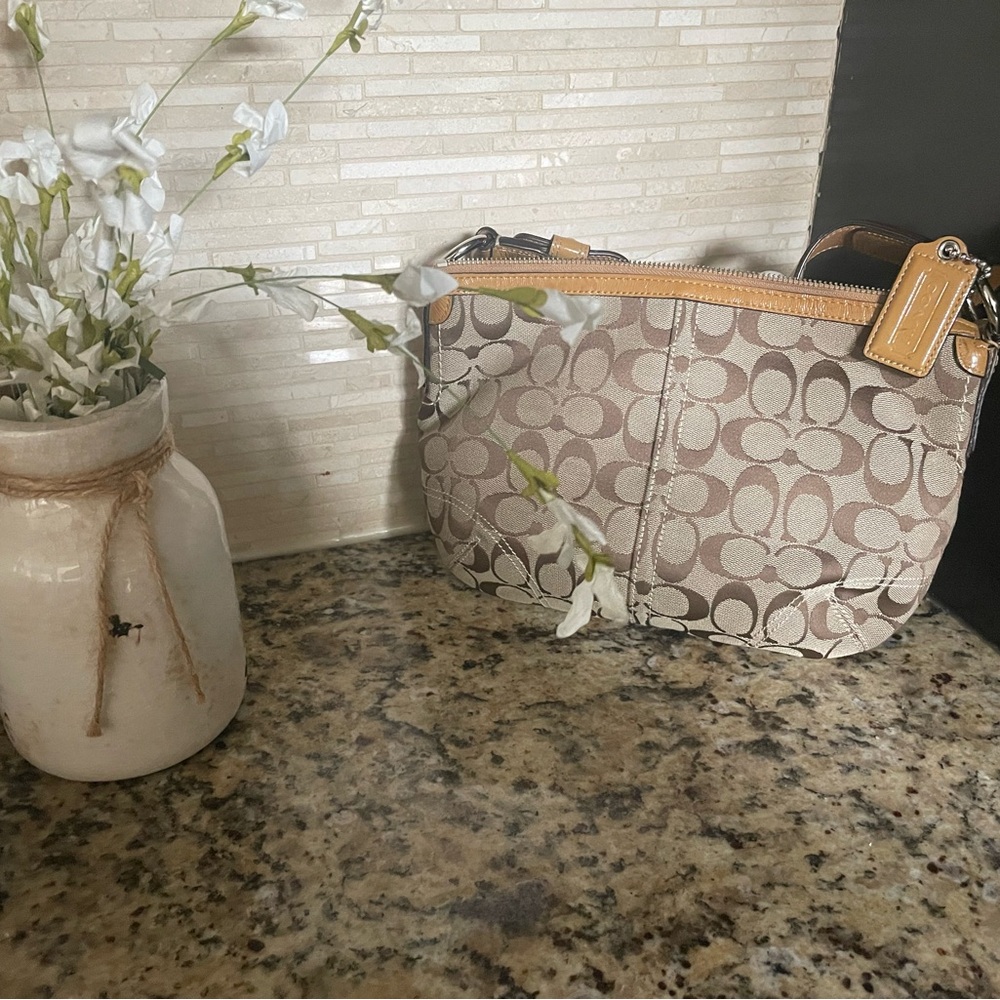 Coach Beige and Brown Signature Shoulder Bag, it has a stain on the strap.